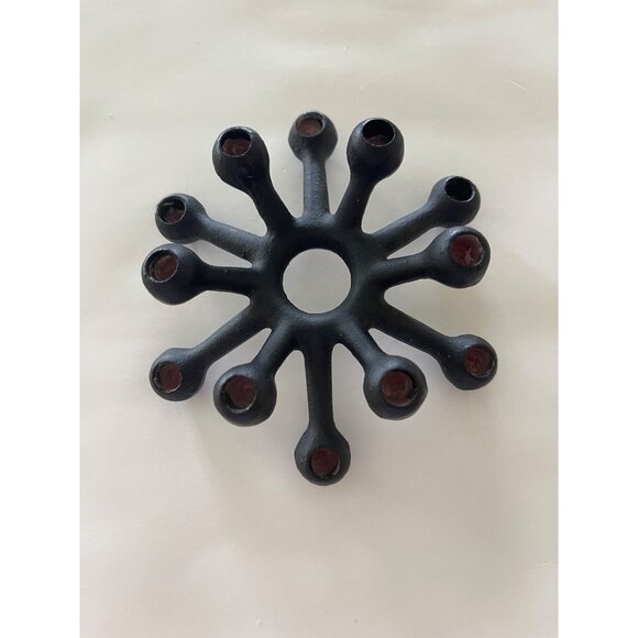 Candlestick by Jens Quistgaard for DANSK Designs, 1962. Cast iron candleholder f